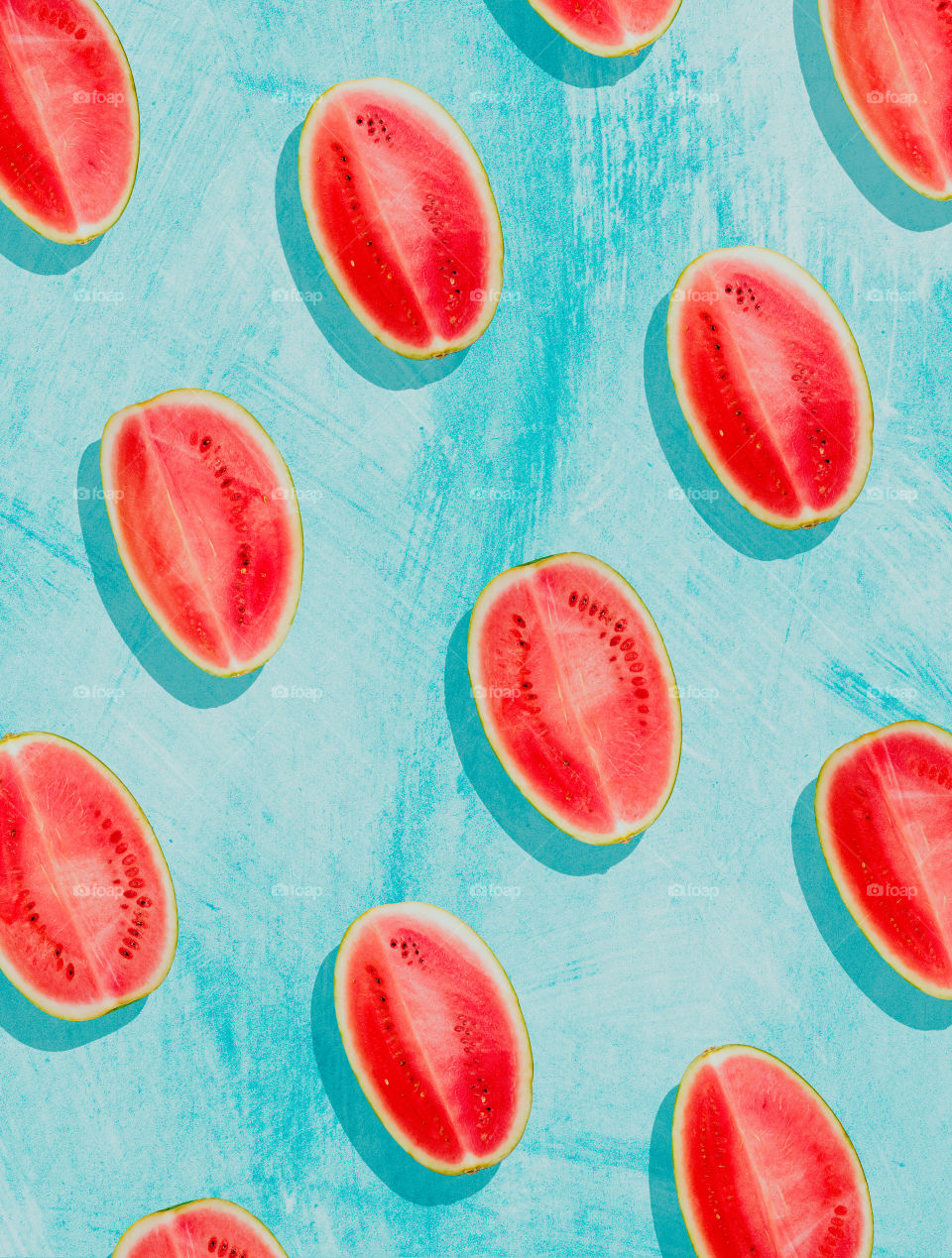 Pieces of watermelon on  background painted in blue