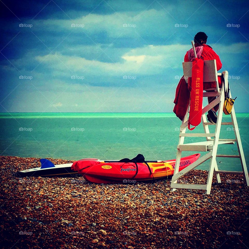 Lifeguard on lookout at Hastings beach