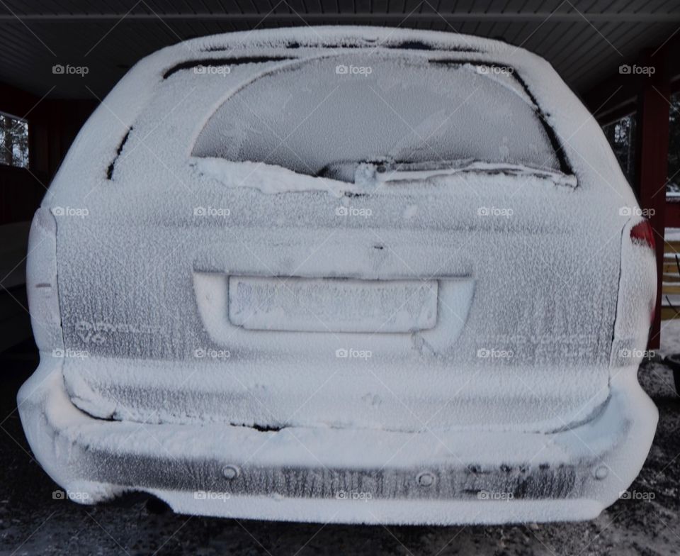 Icy and snowy car