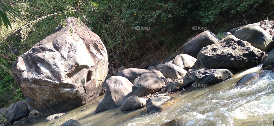 The big rock in the middle of the river