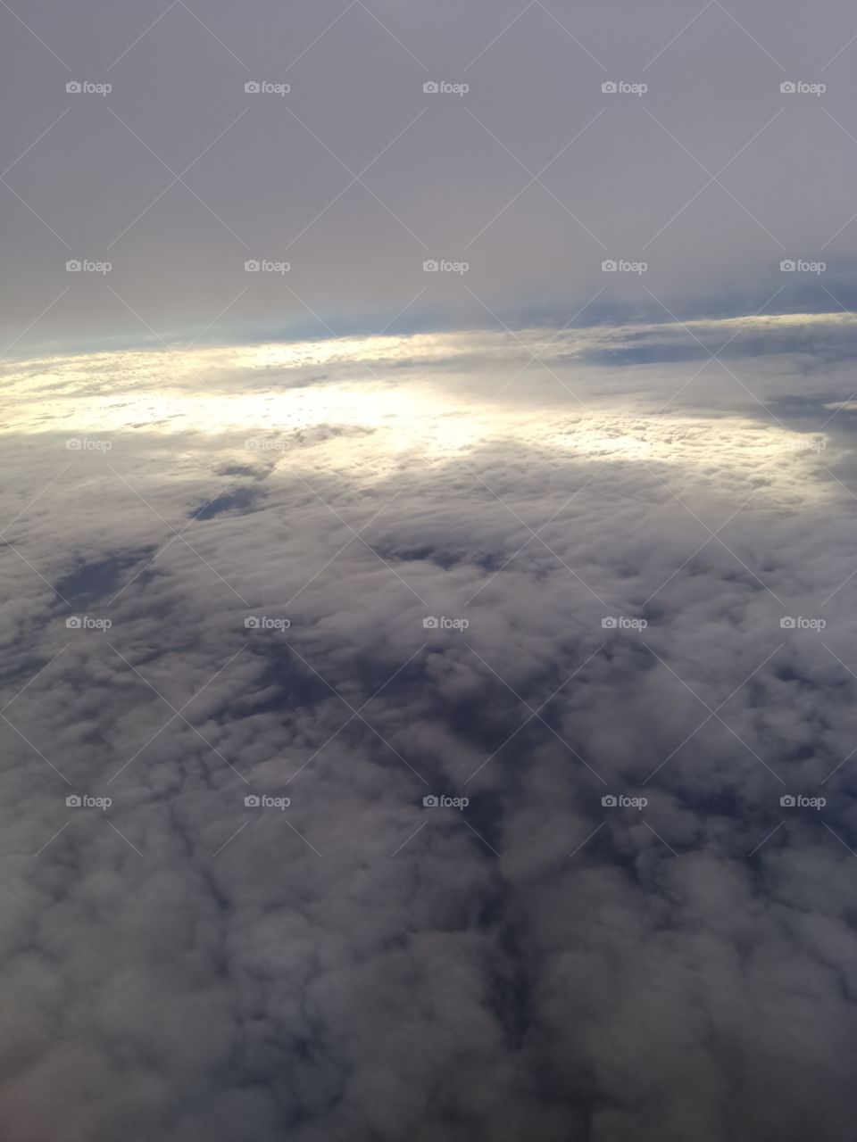 Over the clouds. Photo taken from the airplane.