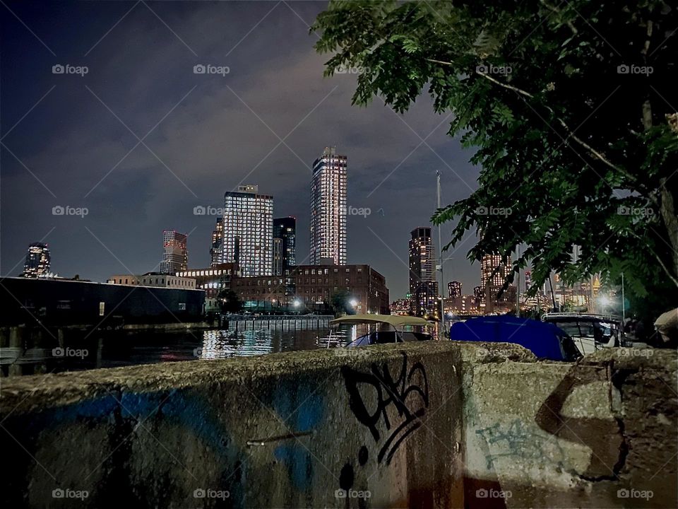 Passage over the wall after a long afternoon of doing laundry often gets pushed into the hours of darkness as the Fall season progresses. Across the „East River“ at „Newtown Creek“ „“Greenpoint“, Bklyn can be seen. 2022. Hypnotic Productions☝️