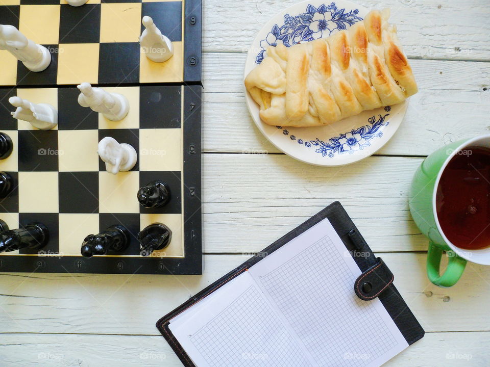 chess, apple pie, a cup of tea and a notebook