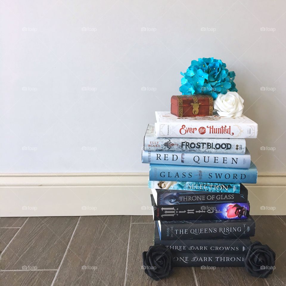 Blue ombré book stack with flowers. 