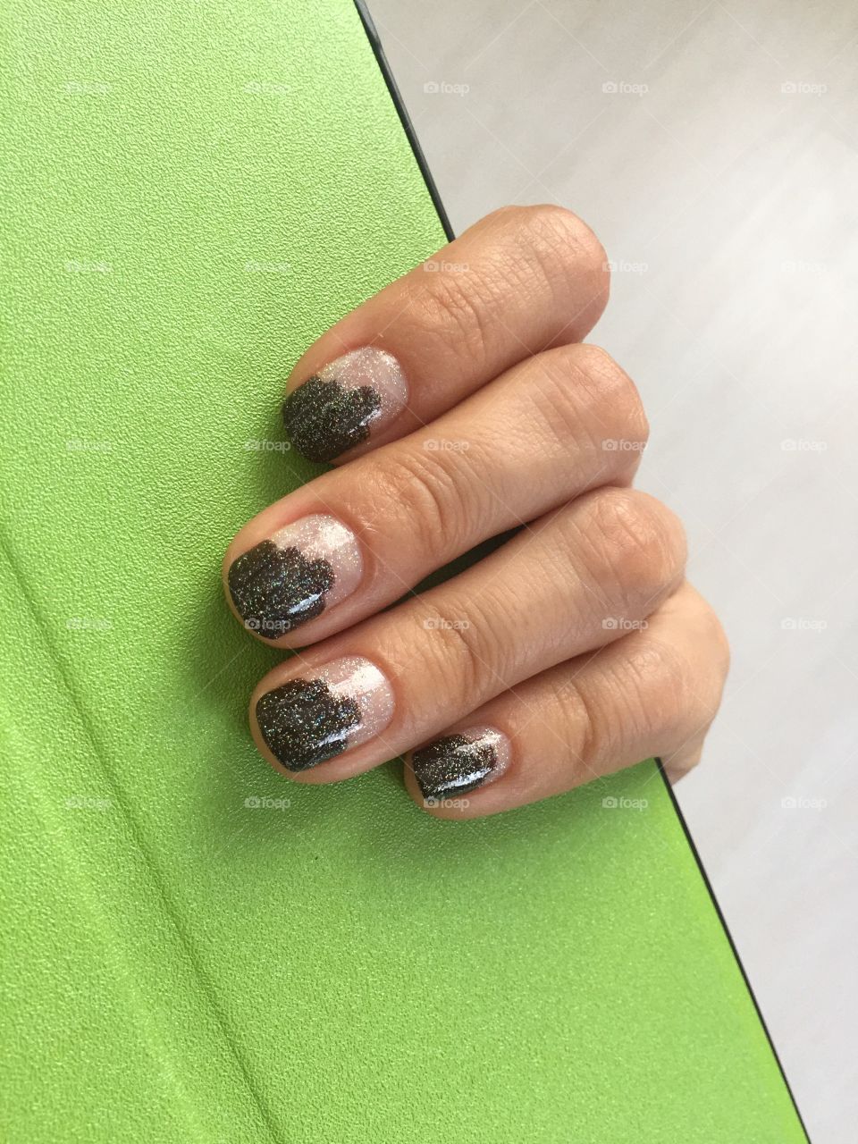 Manicure with dark brown and tinsel