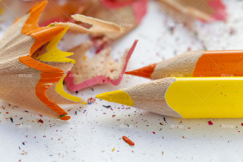 Close-up of colored pencils with shaving