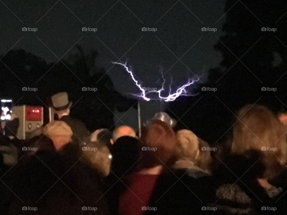 A crowd gathered in front of a lightning demonstration. 