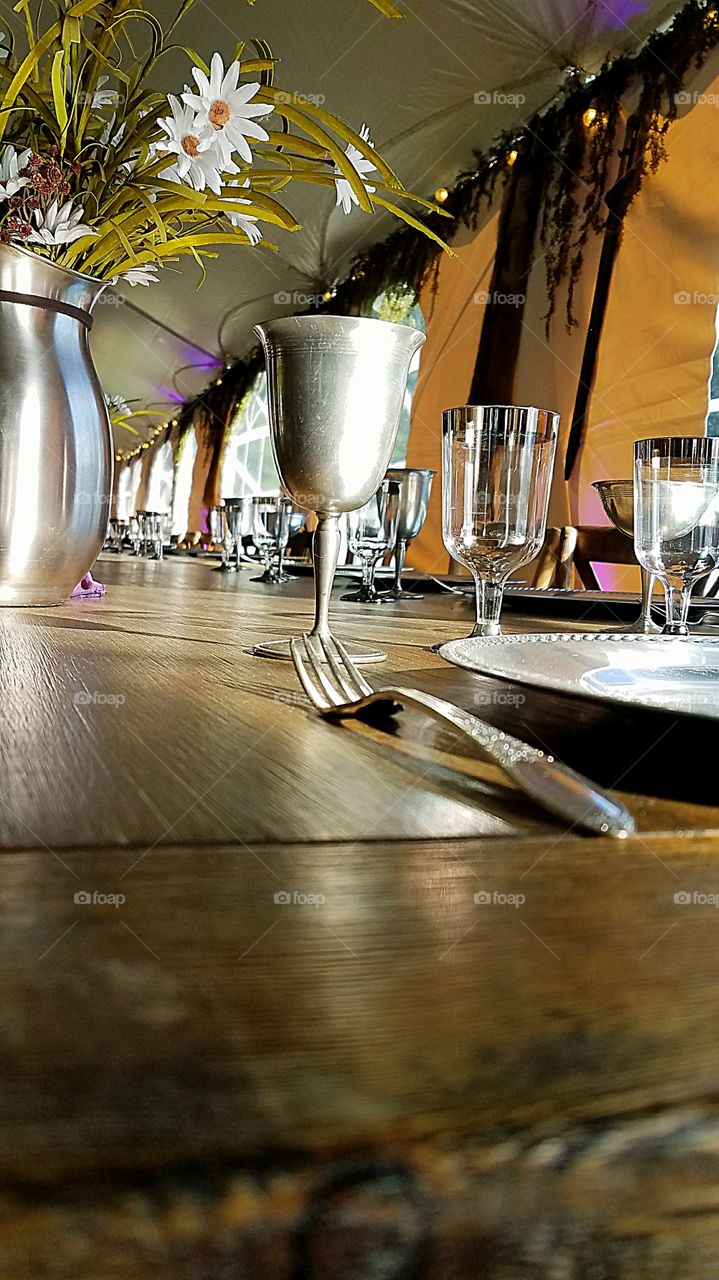 medieval table settings on a long wooden table