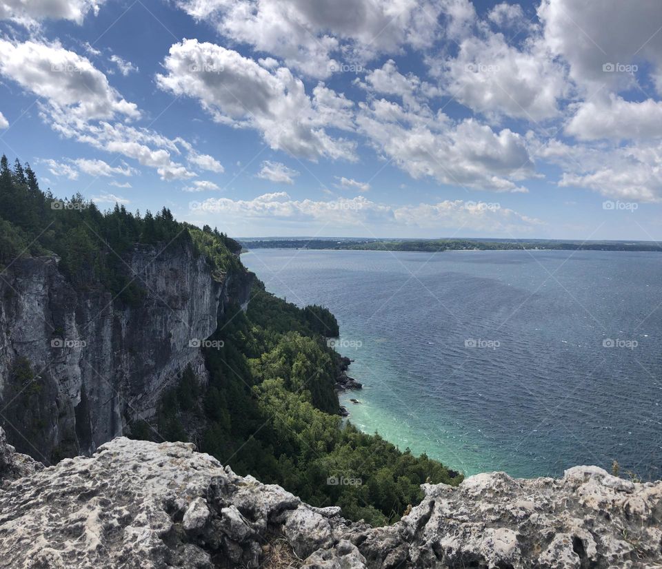 Lake view from the mountain and a cloudy blue sky