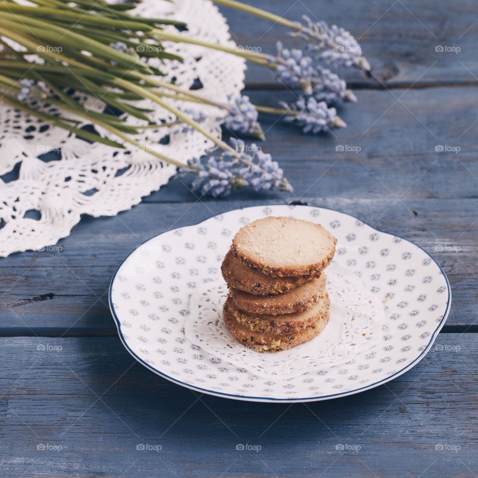 cookies on the saucer on the wooden table