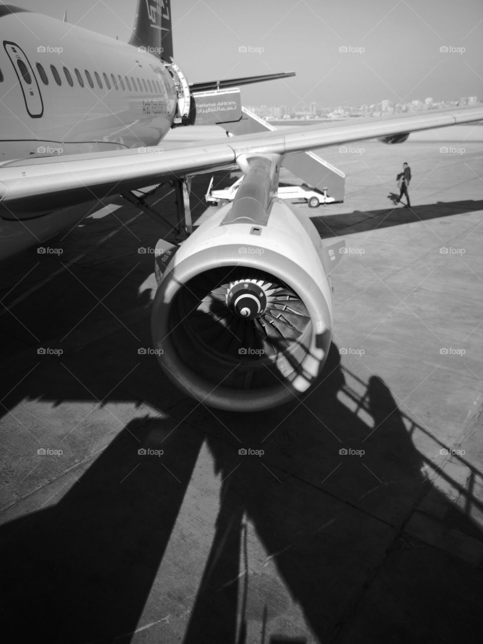Jet engine and plane wing from airport.