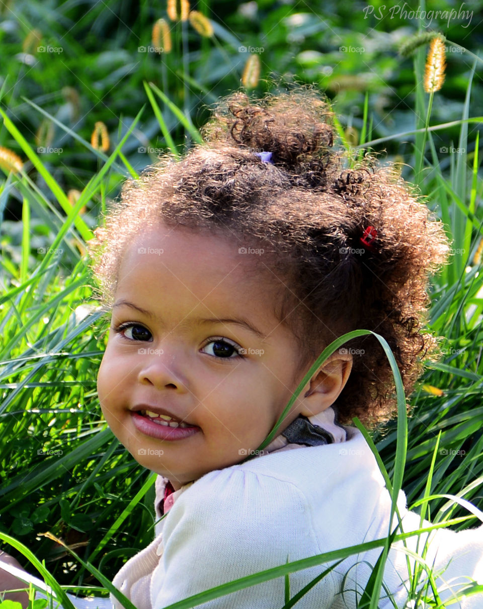 African American little girl on grass