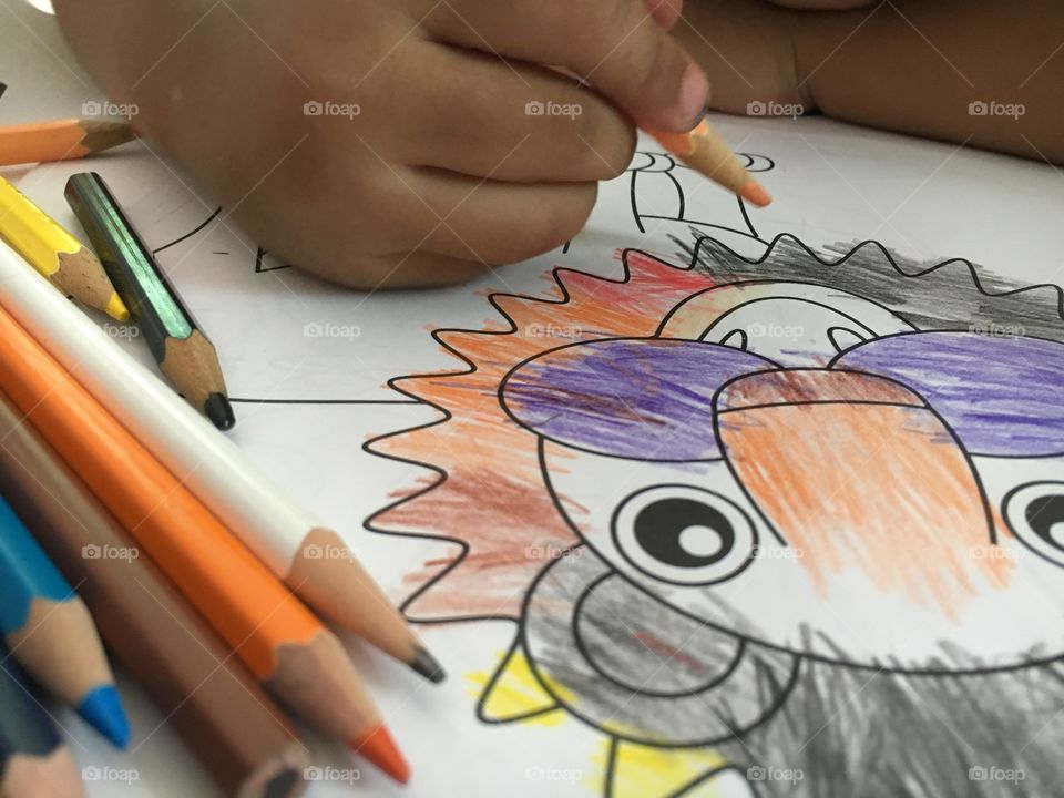 Kids drawing cartoon with color pencil 