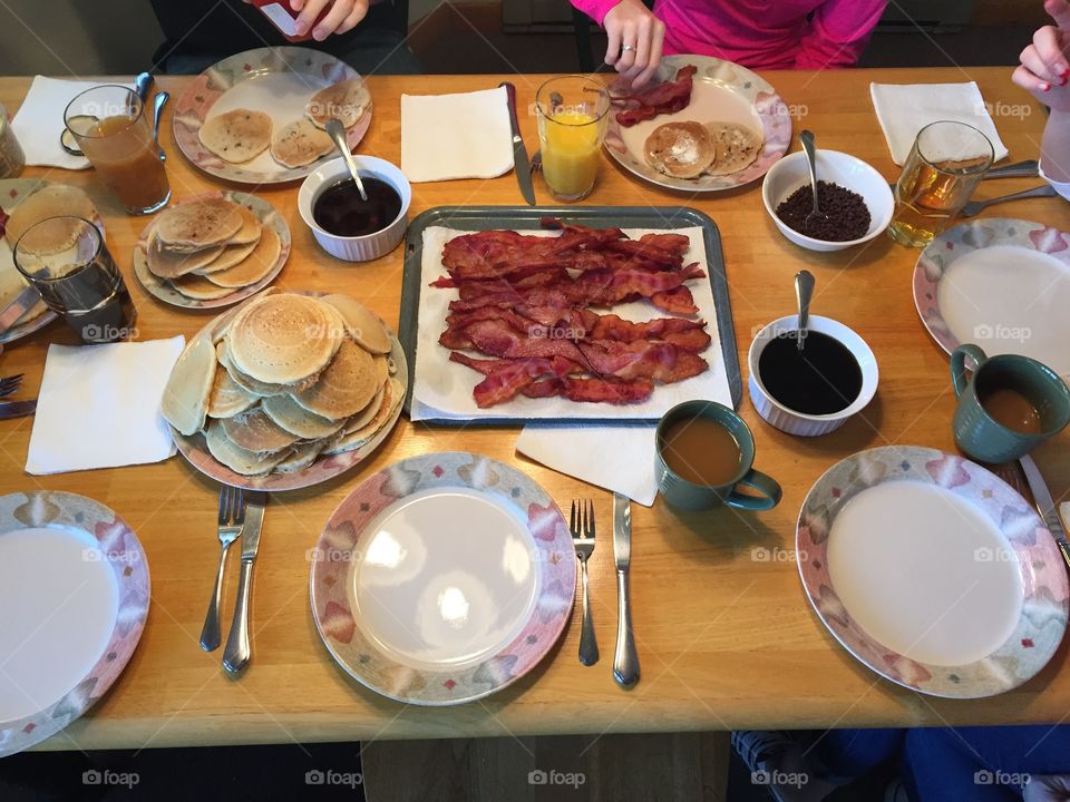 Breakfast. Family breakfast of bacon, pancakes, and coffee