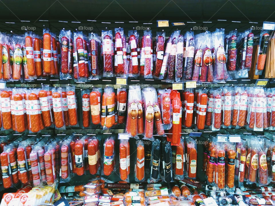 smoked sausage on the counter of the store