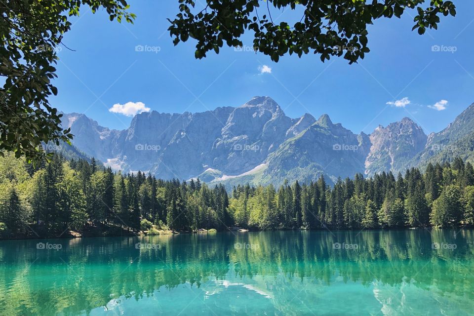 Emerald lake beneath the mountain