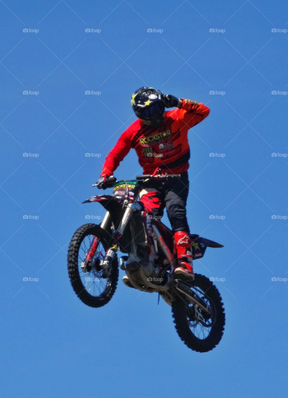 Jumping Motorcycle Stunt. Motorcycle Rider Jumping His Bike