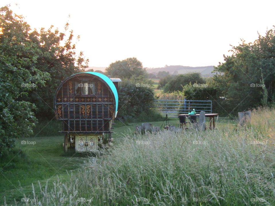 gypsy caravan with the evening summer sunshine fading