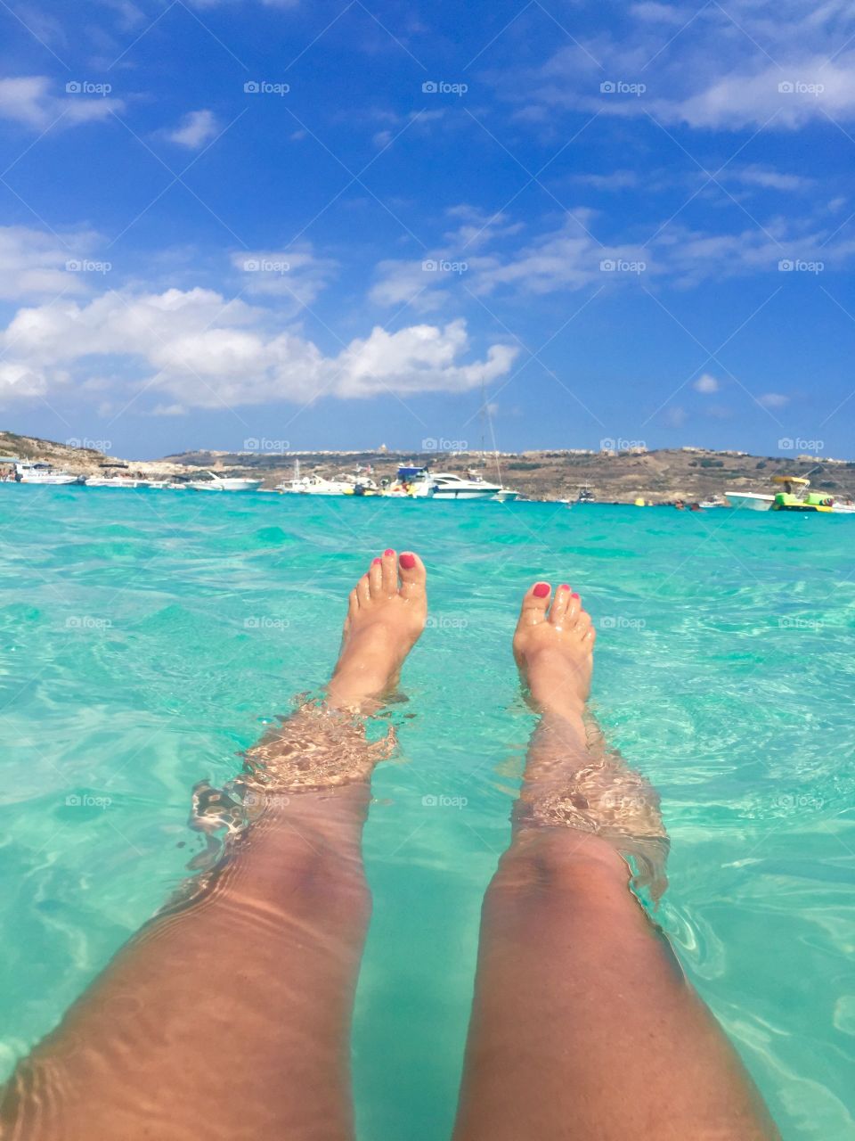Relaxing. Floating in the crystal blue waters at Comino