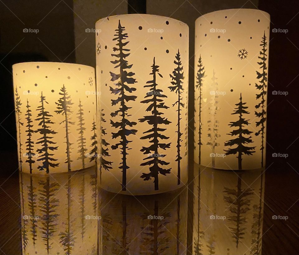 Candles reflecting on a table