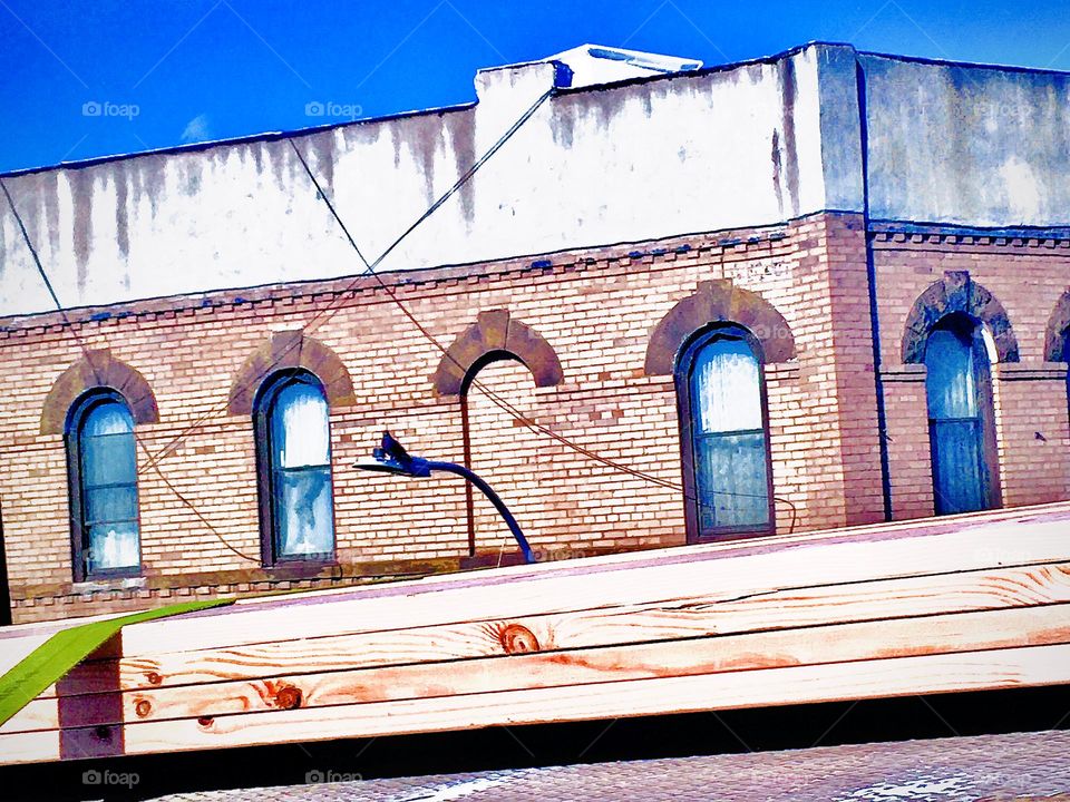 An old fashioned looking New York City building photographed from a moving car that took us from Forest Green, Bklyn to our destination in Long Island City, Queens, NY in the summer of 2020. Hypnotic Productions