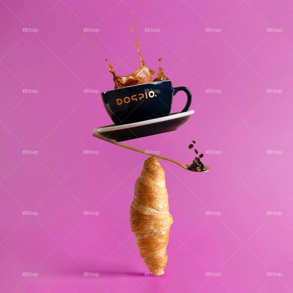 Coffee splash on the pink background 