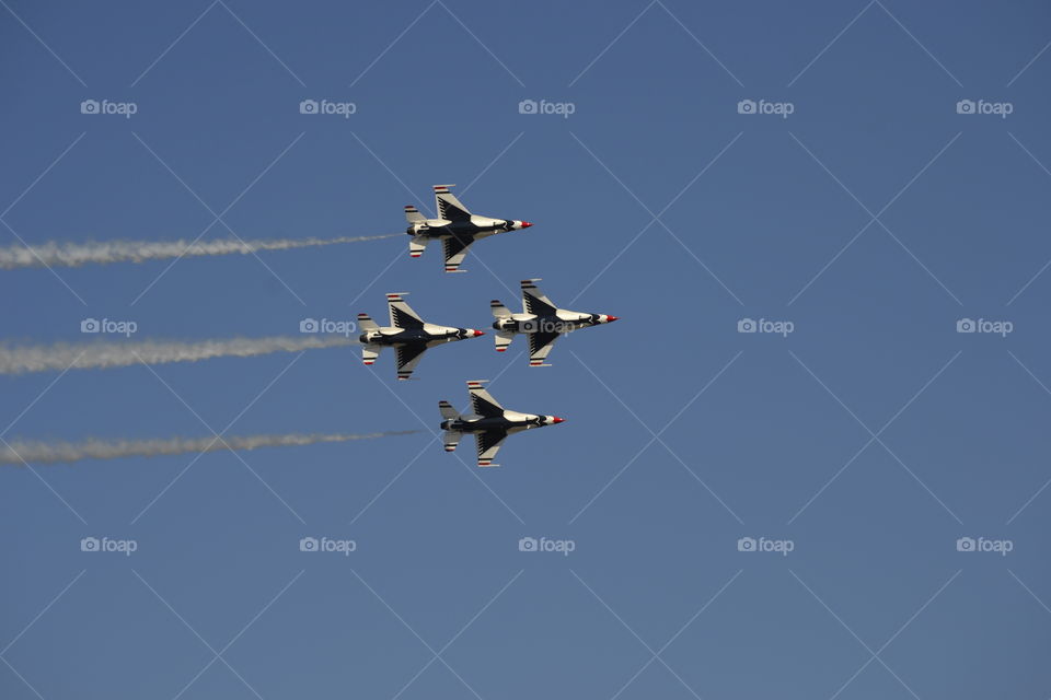 USAF Thunderbirds fly by in the diamond formation.