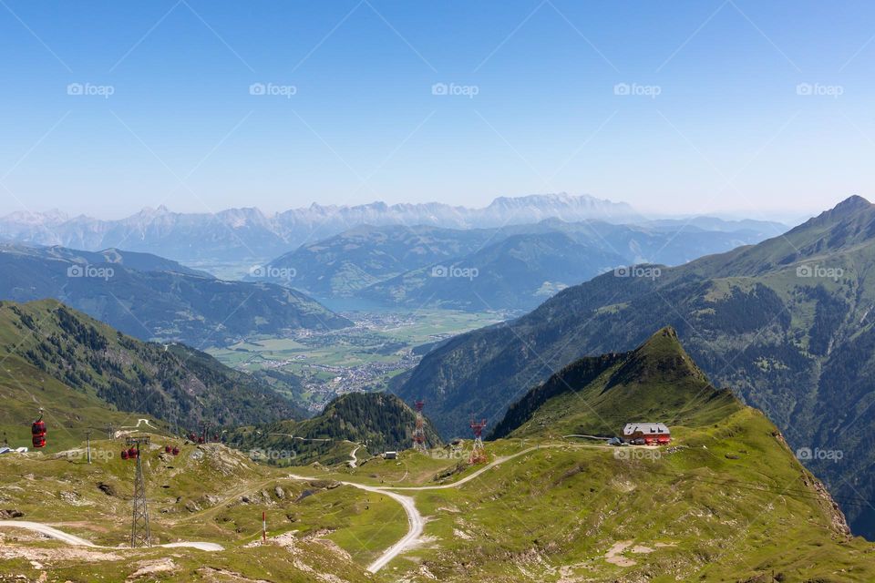 Panoramic view of cable cars, mountains, Kaprun and Zell am see from Kitzsteinhorn Austria 