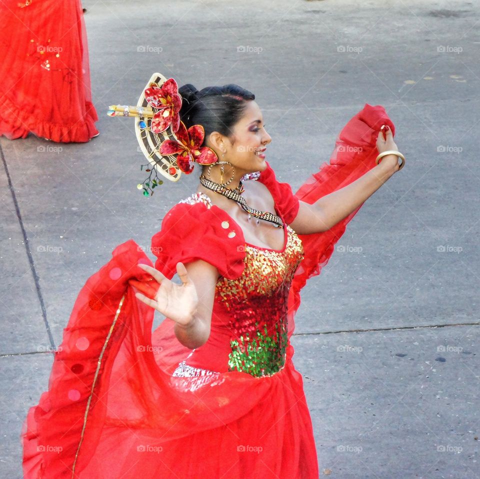 Dancing girl, with a red dress, during the Barranquilla's Carnival