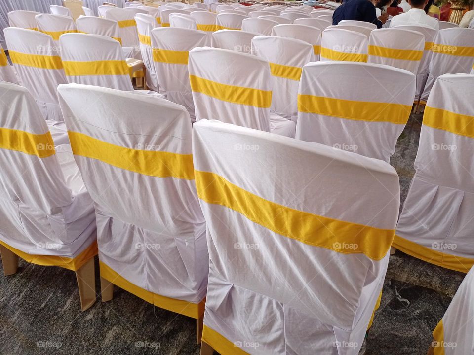plastic chairs covered with Whait colour cloth goldan colour border