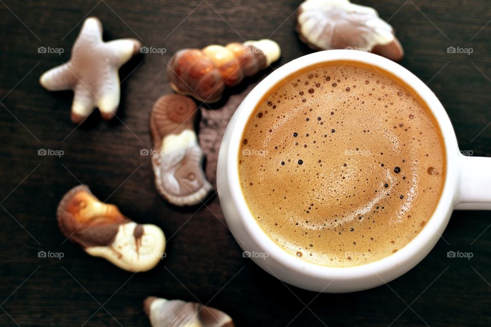 Close-up of cappuccino and chocolate