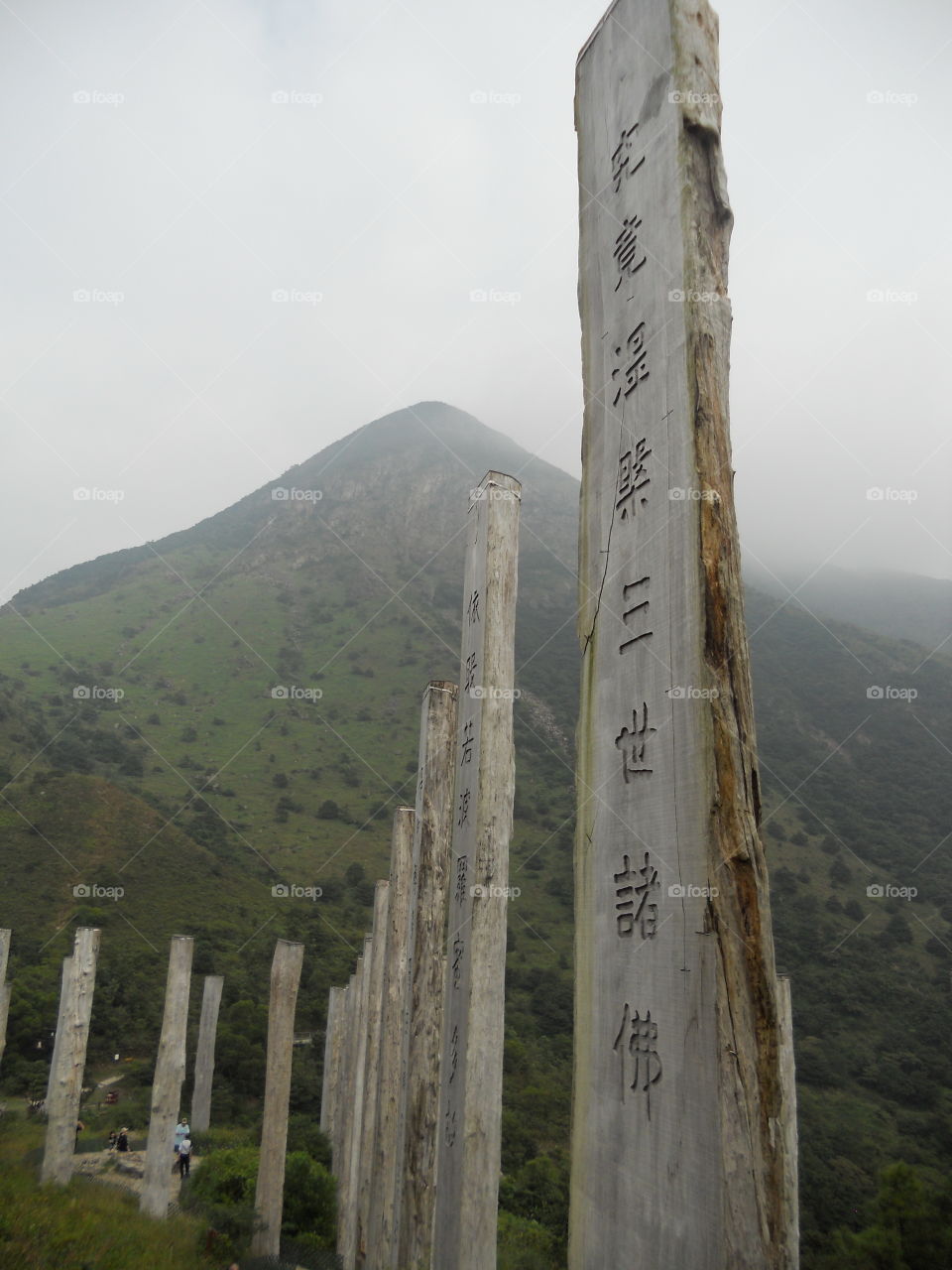 The Heart Sutra carved on wooden posts along a path surrounding the "Big Buddha" (Tian Tan Buddha)  on Lantau  Hong Kong