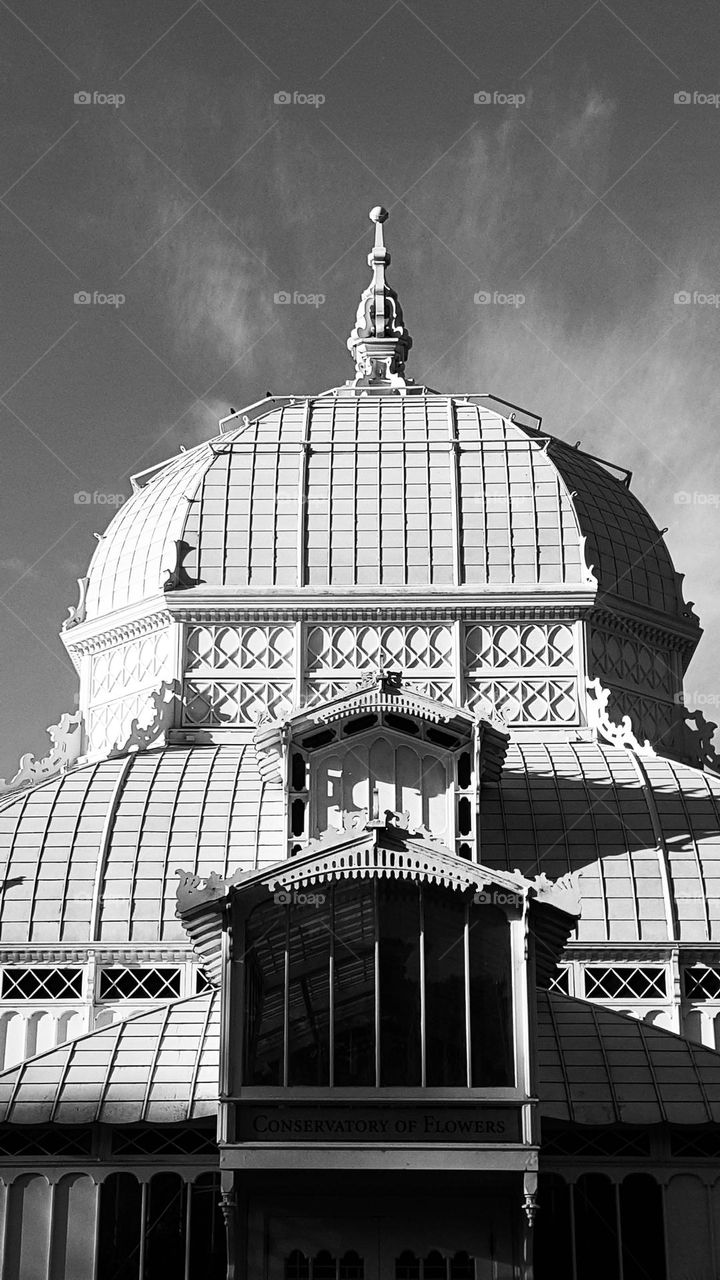 Conservatory of Flowers in Golden Gate Park in San Francisco California with its distinctive Victorian style architecture and milky white glass panels 