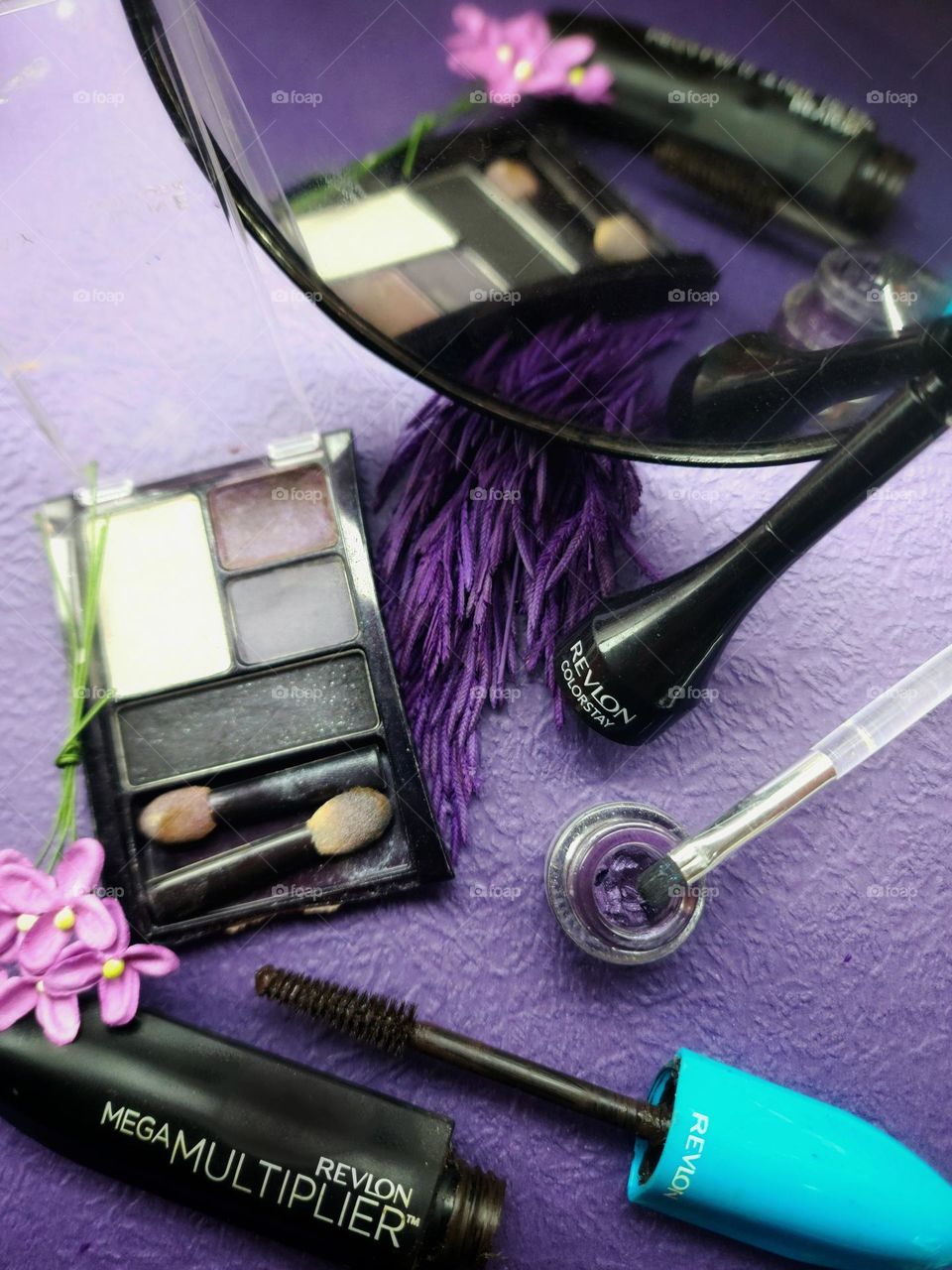 Purple themed makeup collection.