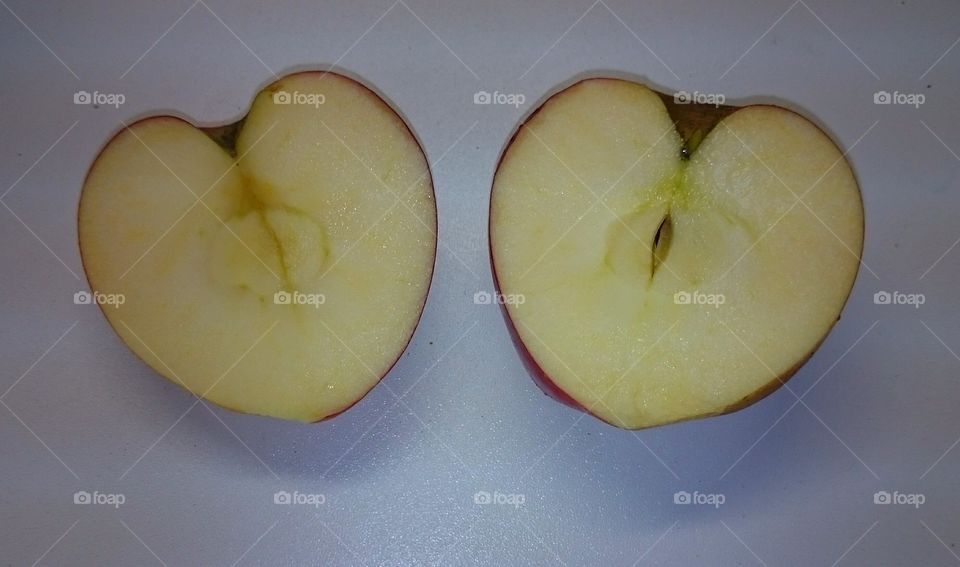 Apple in two heartshaped halfs