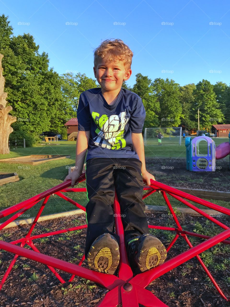 Big smiles on the jungle gym 

