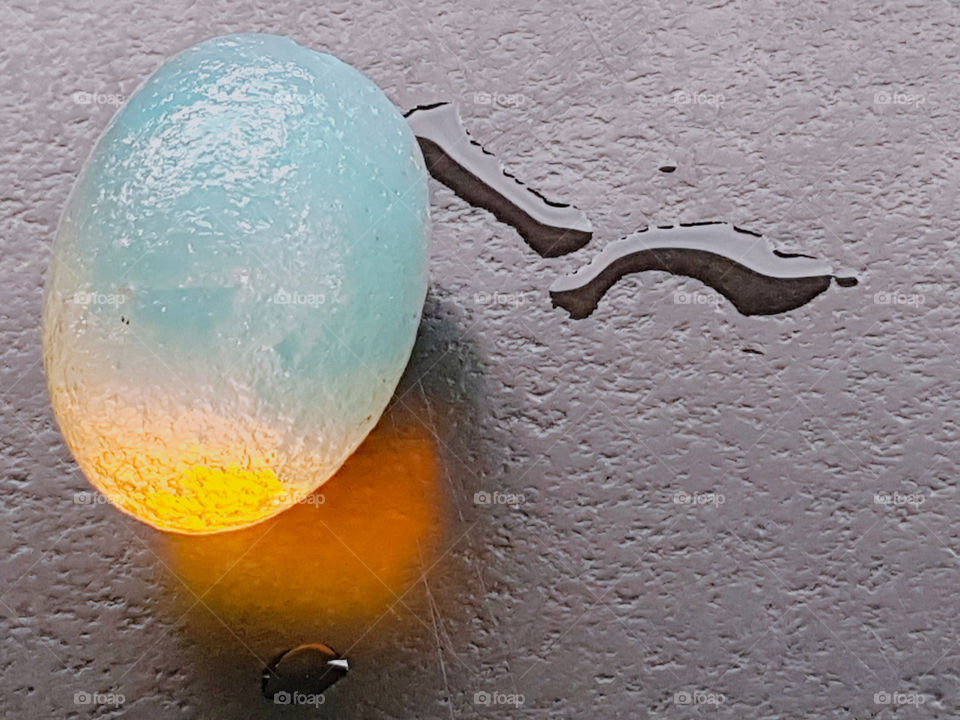 This is a moon stone. it's amazing how it gives off it's own light and energy. Sitting with a splash of water.