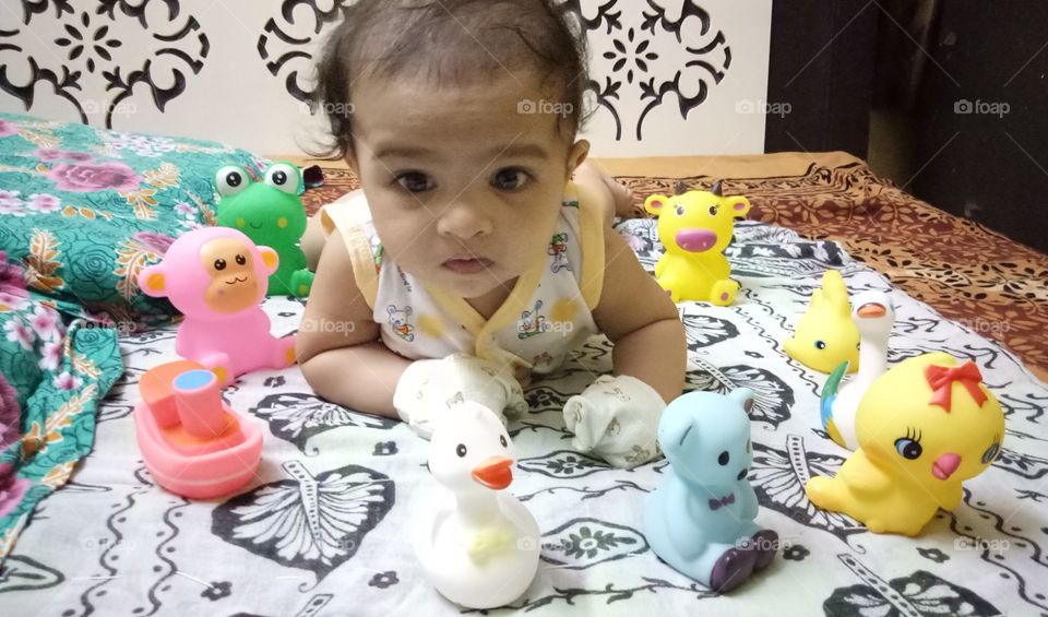 small cute baby playing with toys