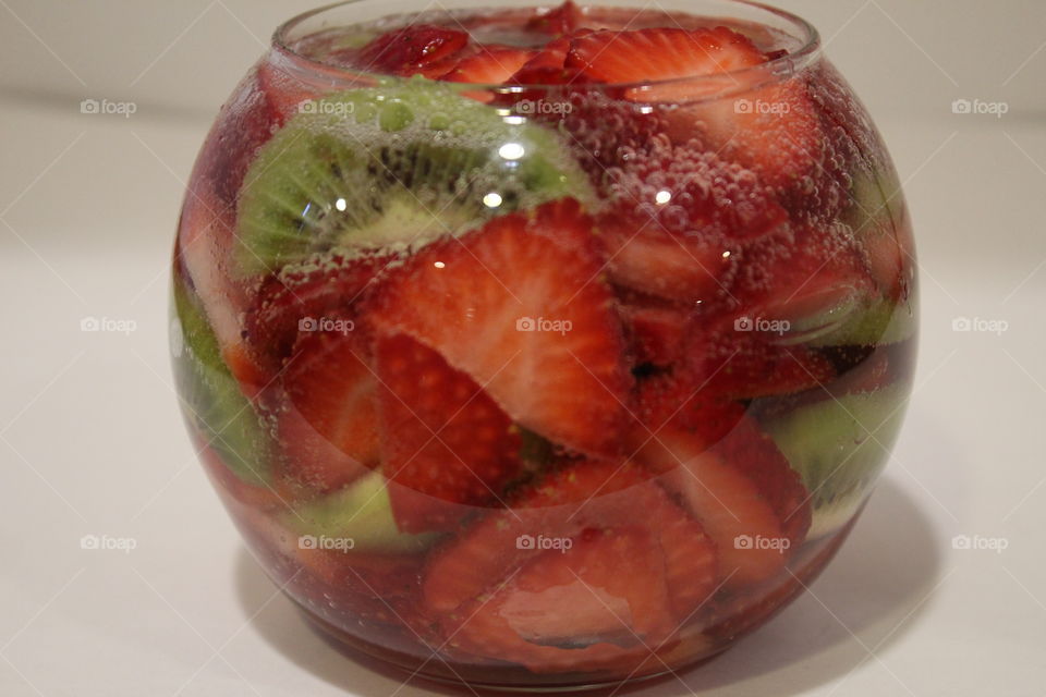 sweet strawberries and kiwis in bowl