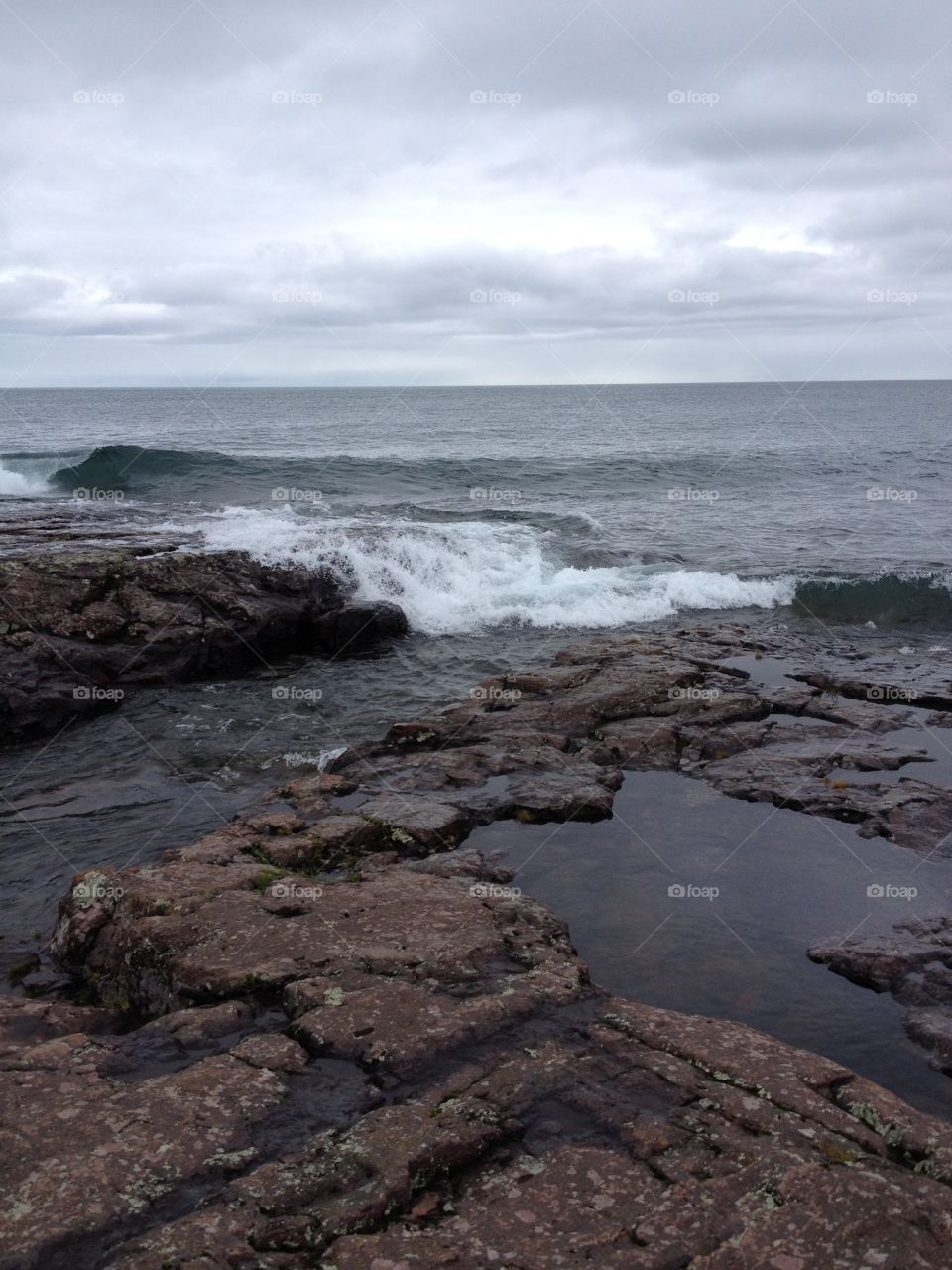 Lake Superior waves crashing over rock