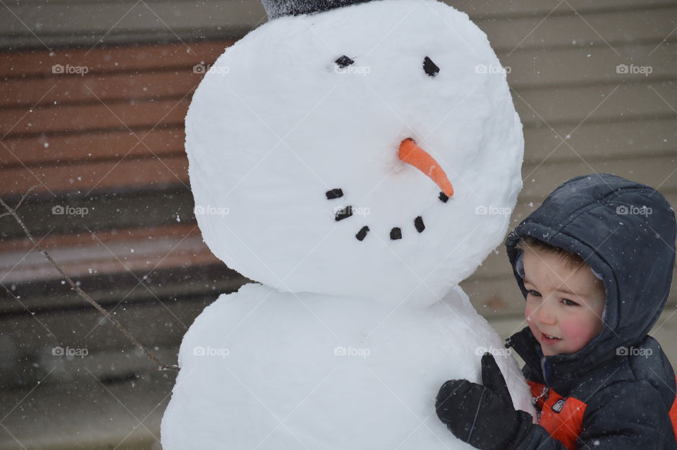 Boy and his snow man