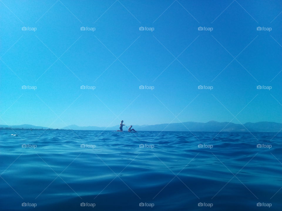 in the middle of the sea and sky