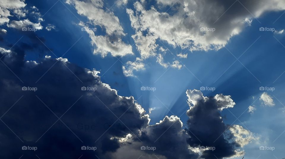Sun through the sky,sky,sun,nature,reflection,landscape,summer,colorful,season,sunset,sunlight,sunshine,shining,dawn,clouds,cloudy,rays,blue