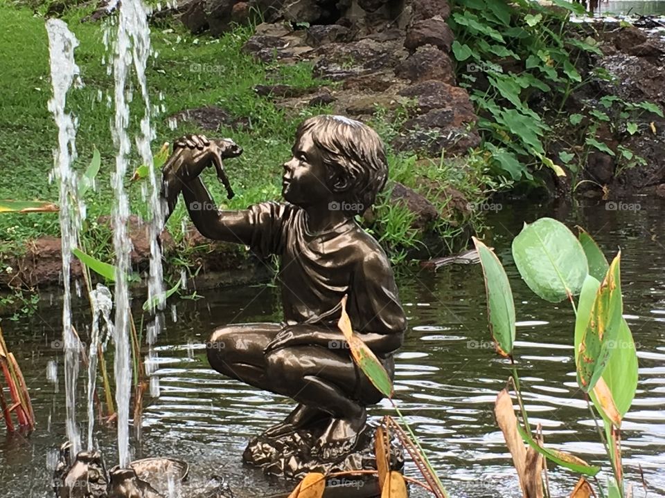 Boy with frog fountain and statue. Tyler Rose Garden, Texas