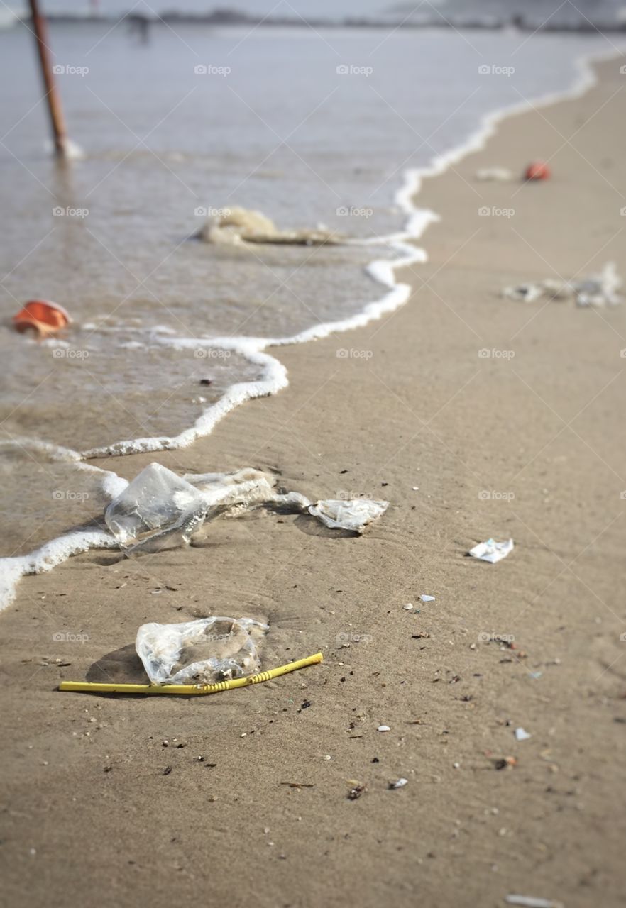 Polluted beach. Rubbish washes up on the beach