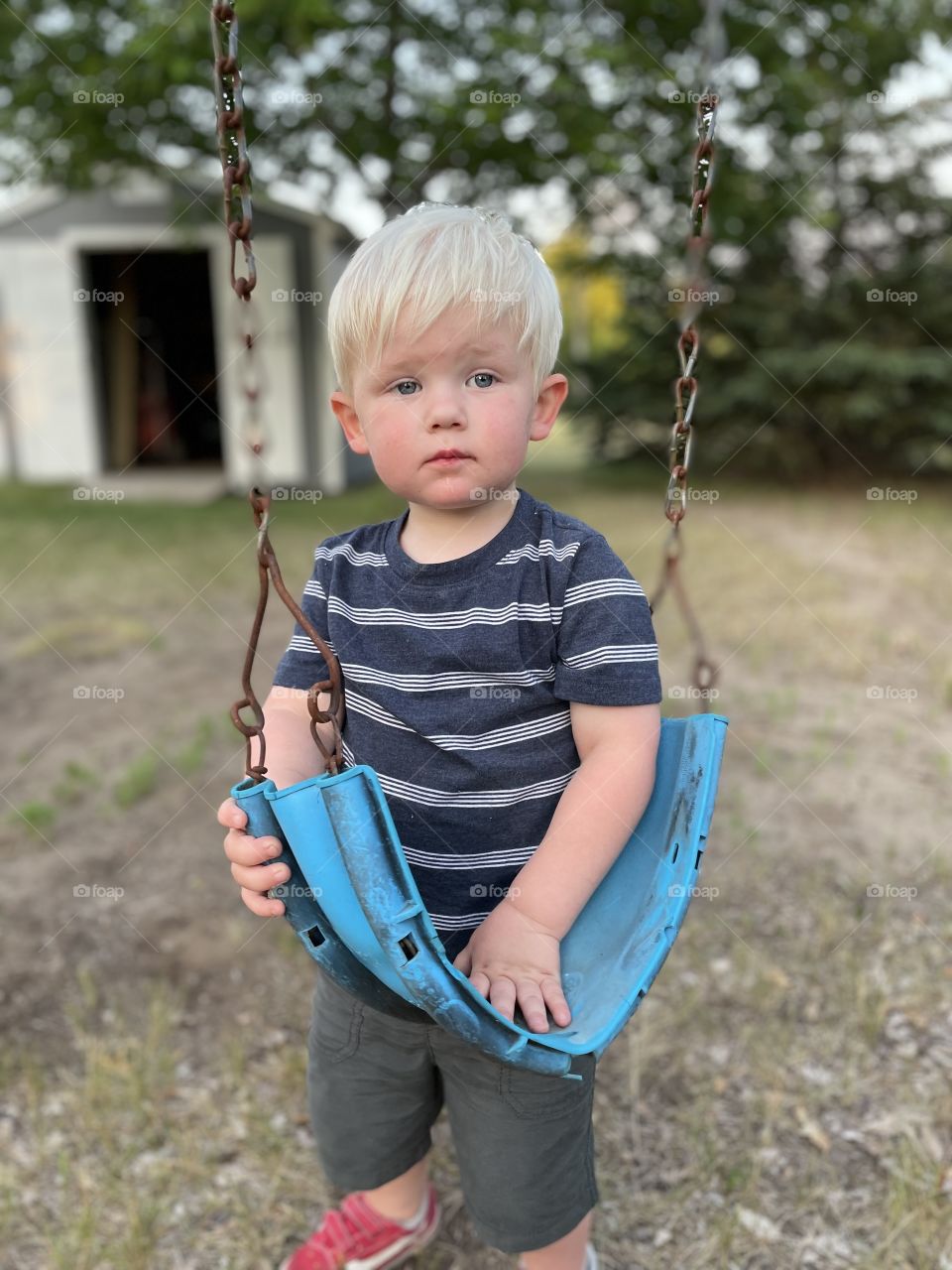My two year old playing with the swings. 