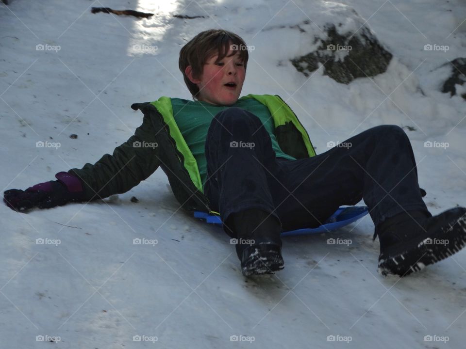 Boy Playing In The Snow
