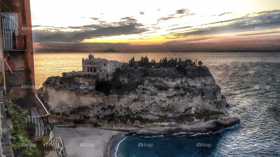 Sunset behind castle in Tropea Italy