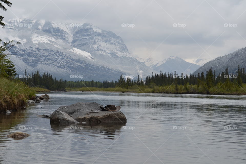 Cowboy hat on a rock in Canada's Rocky Mountain wilderness 