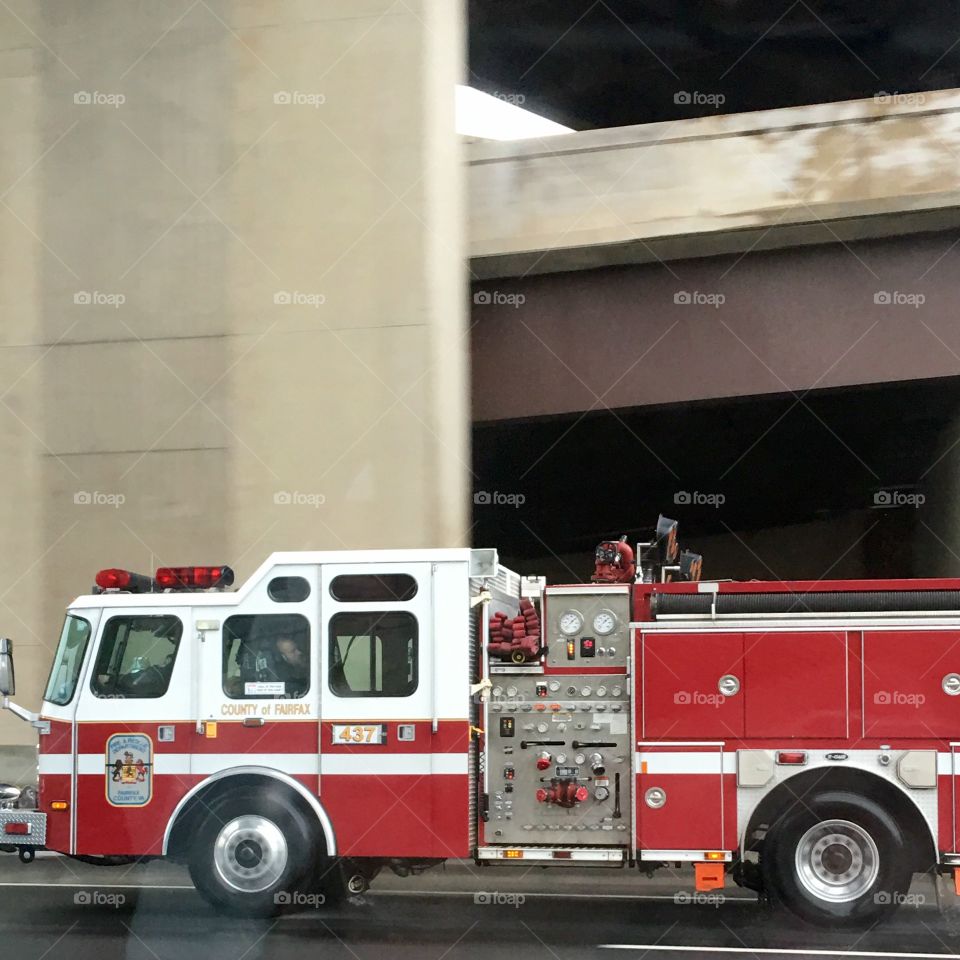Fire Truck on highway, fireman sleeping in back. They were getting ready to take exit.